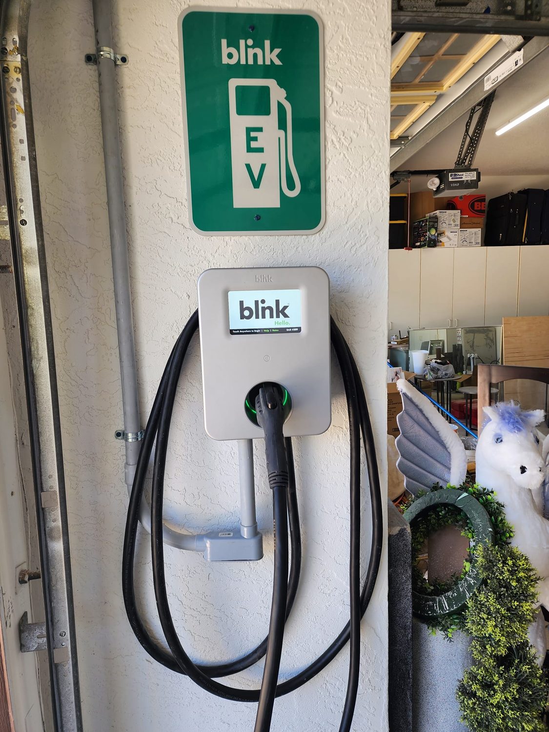 Level 2 EV charger cleanly installed on a residential garage wall