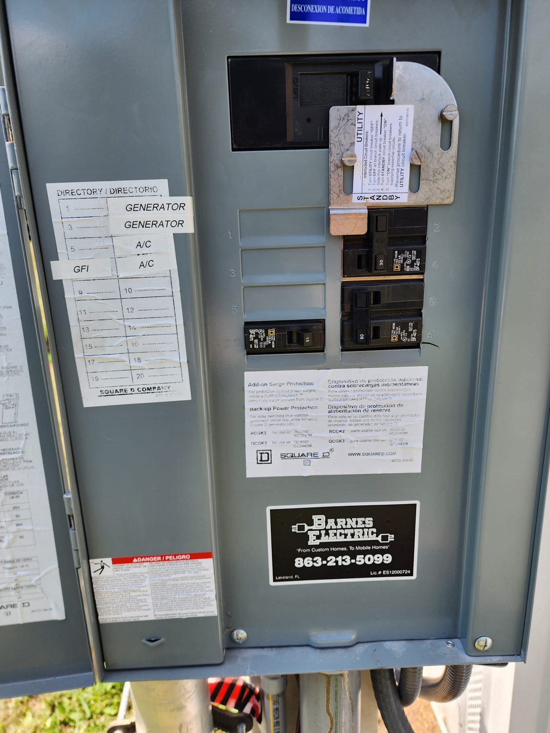 Completed main panel — cover on, neatly labeled breakers