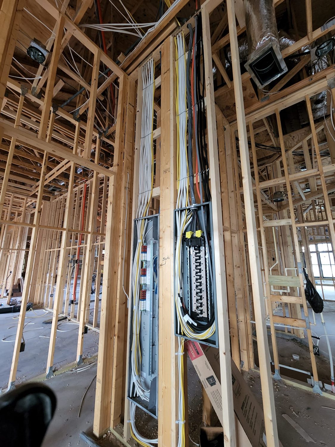 Structured wiring and main panel installed at framing on a new build